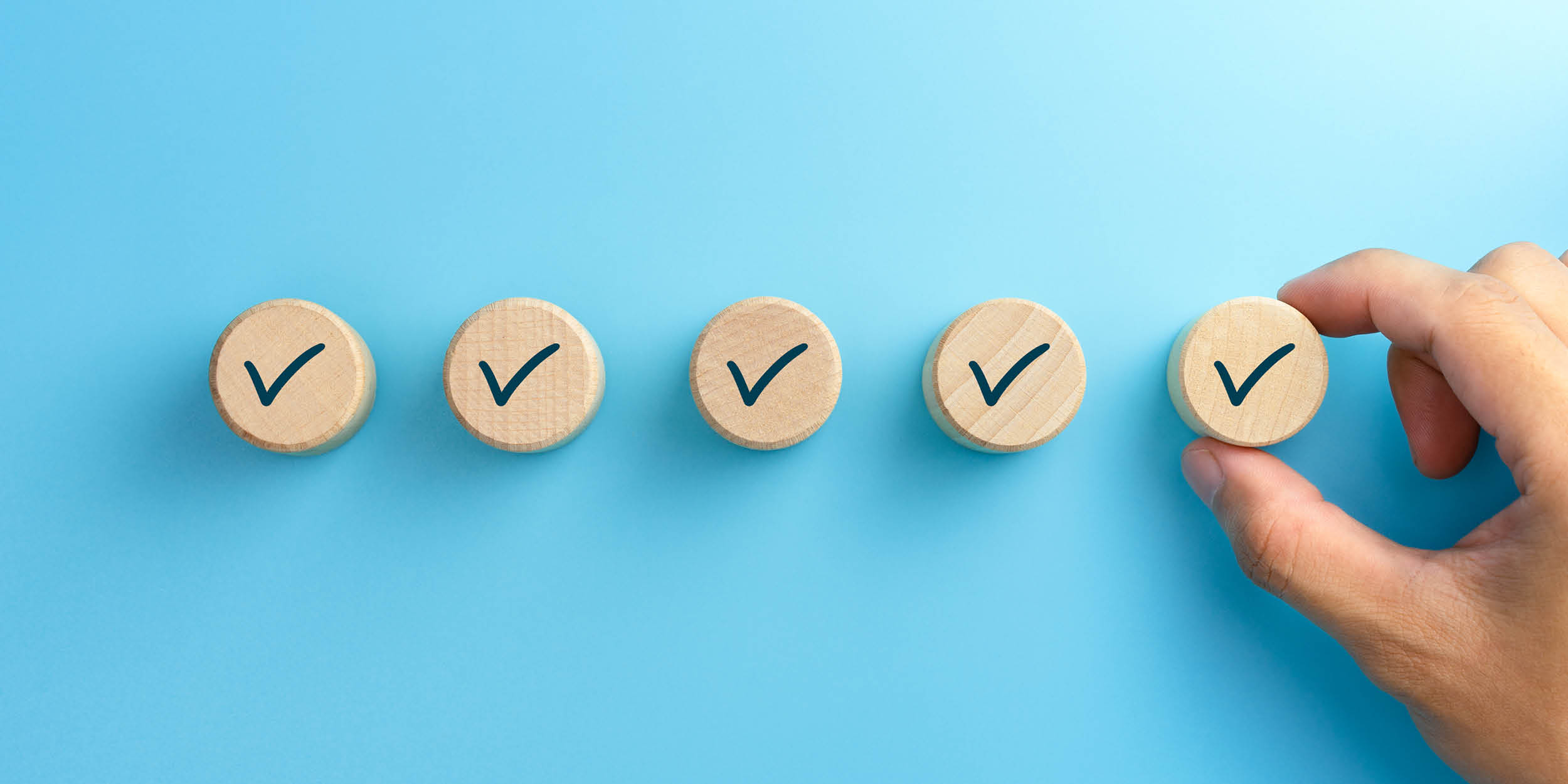 ticked wooden buttons on blue background